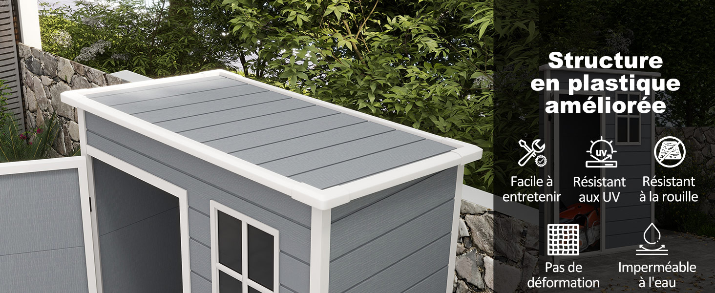 un cabanon gris avec un toit blanc et une fenêtre.